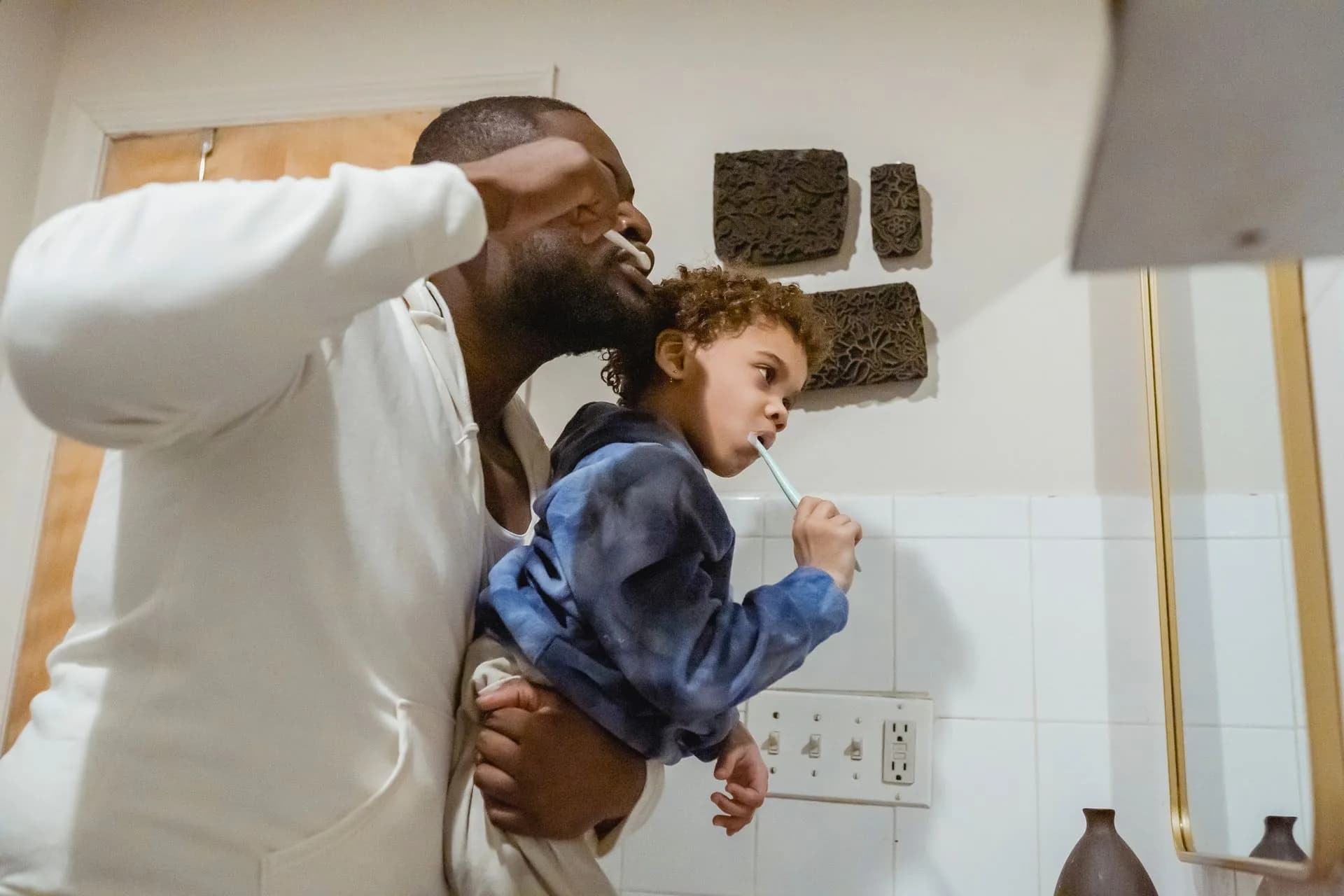 Friendly dentist caring for a young patient's teeth