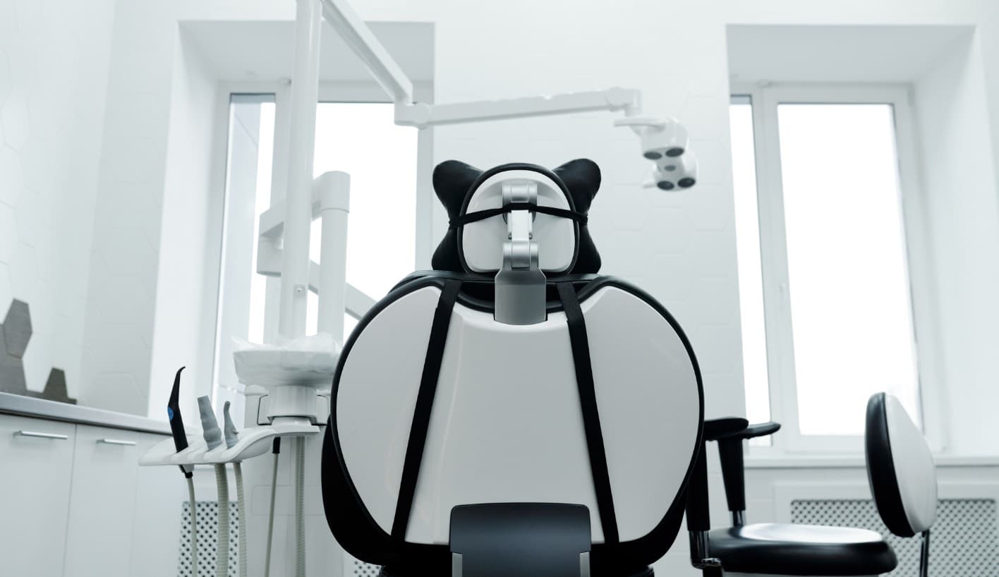 Dentist fitting a dental crown restoration